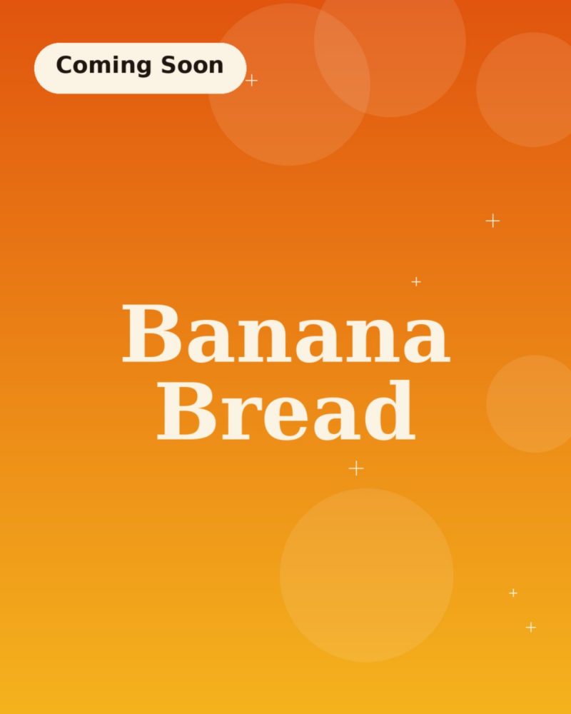A cut-open loaf of banana bread showing its soft crumb