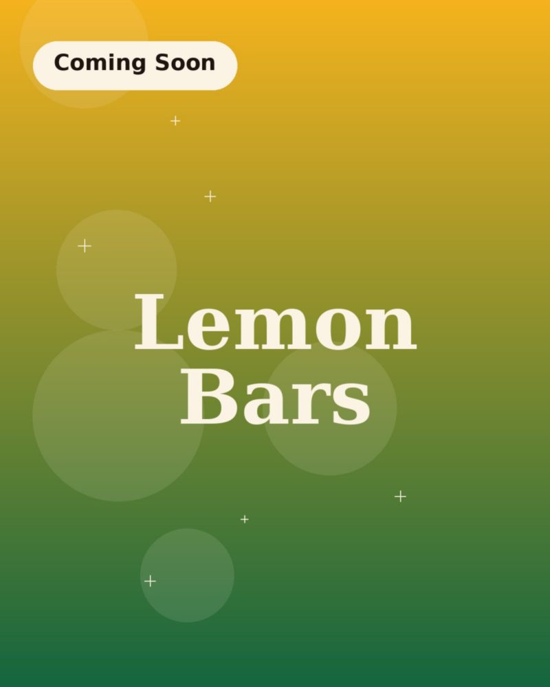 Lemon bars dusted with powdered sugar, cut into uneven squares
