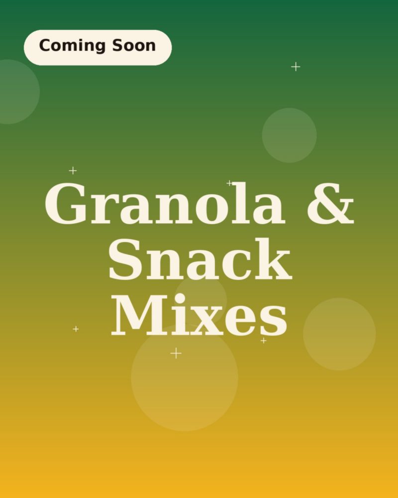 A bag of clustered granola and caramel corn spilling onto a kitchen counter